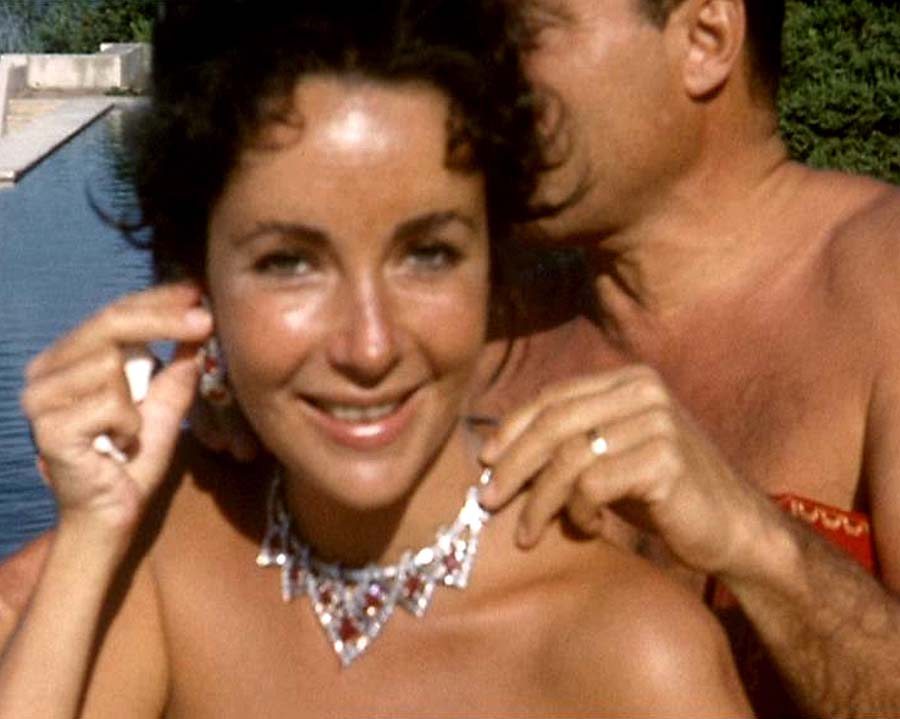 Elizabeth taylor and Mike Todd by the pool with rubies and diamonds